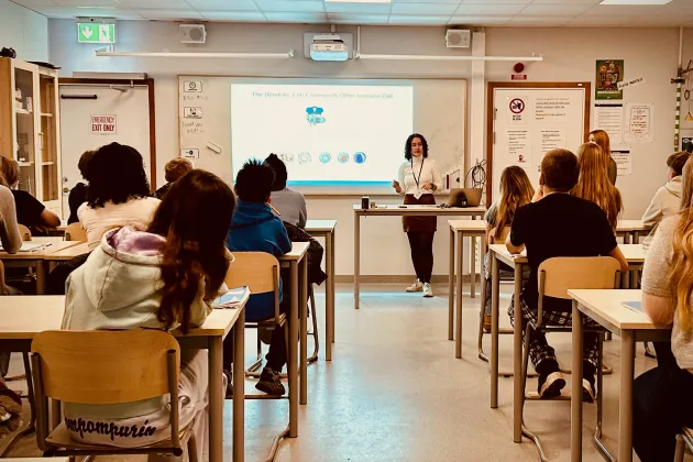 Photo of Abby giving a presentation during Science to Schools 2025.