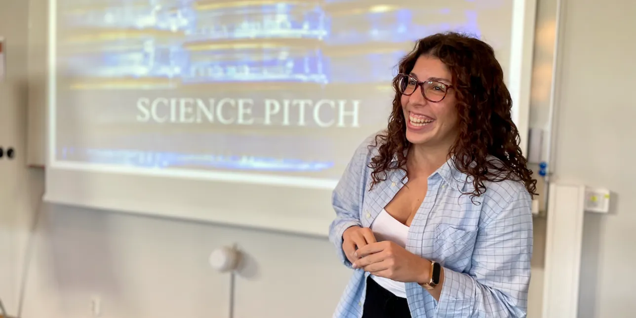 Photo of Maria T presenting during a science pitch session. photo.