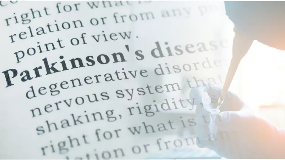 A photo of a text describing Parkinson's disease merged with a photo of a hand pipetting